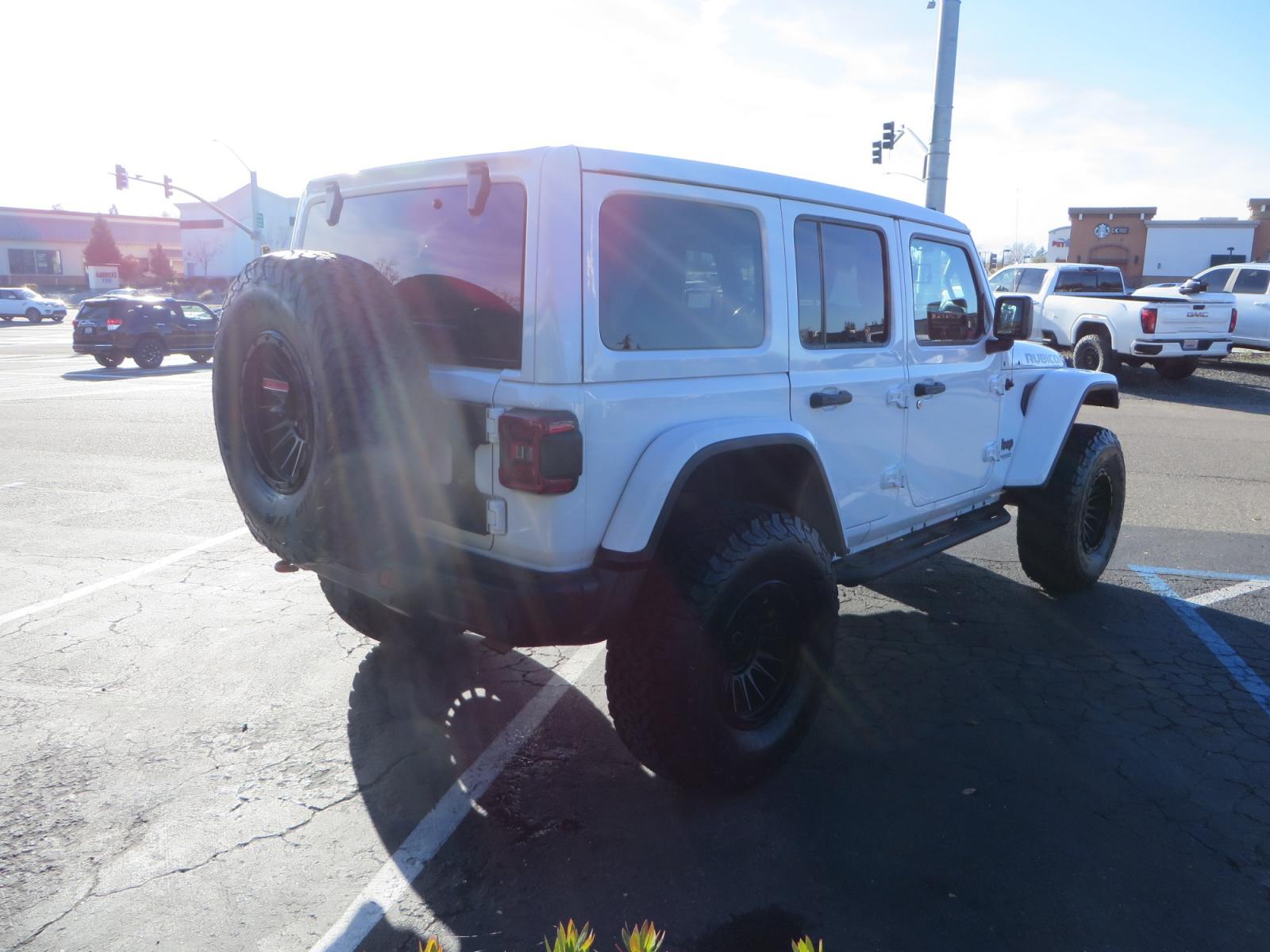 2020 White /TAN Jeep Wrangler Unlimited Rubicon (1C4HJXFG8LW) with an 3.6L V6 DOHC 24V FFV engine, 6A transmission, located at 2630 Grass Valley Highway, Auburn, CA, 95603, (530) 508-5100, 38.937893, -121.095482 - 3" Zone offroad suspension system, Fox adventure series shocks, rocksliders, Teraflex HD tire relocation, Mopar HD tailgate hinge, 17" KMC wheels, and 37" BFG KO2 tires. - Photo #4